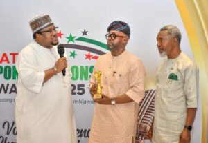 Hon.Akintunde Rotimi Chairman, House Committee, Media & Public Affairs presenting award Olufemi Soneye of NNPCL as Spokesperson of the year while Dr. Neliaku watches