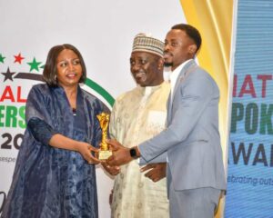 Prof. Emmanuel Dandaura and his wife, presenting award to Niyi Aderibigbe of Transcorp "Distinguished Spokeperson (Hospitality Sector)