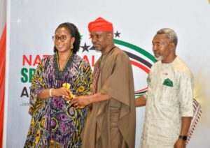 NIPR President Dr. Ike Neliaku and his wife presenting ward of "Outstanding Spokeperson (Crisis Management private sector) to Emmanuel Osedebamen of Julius Berger)
